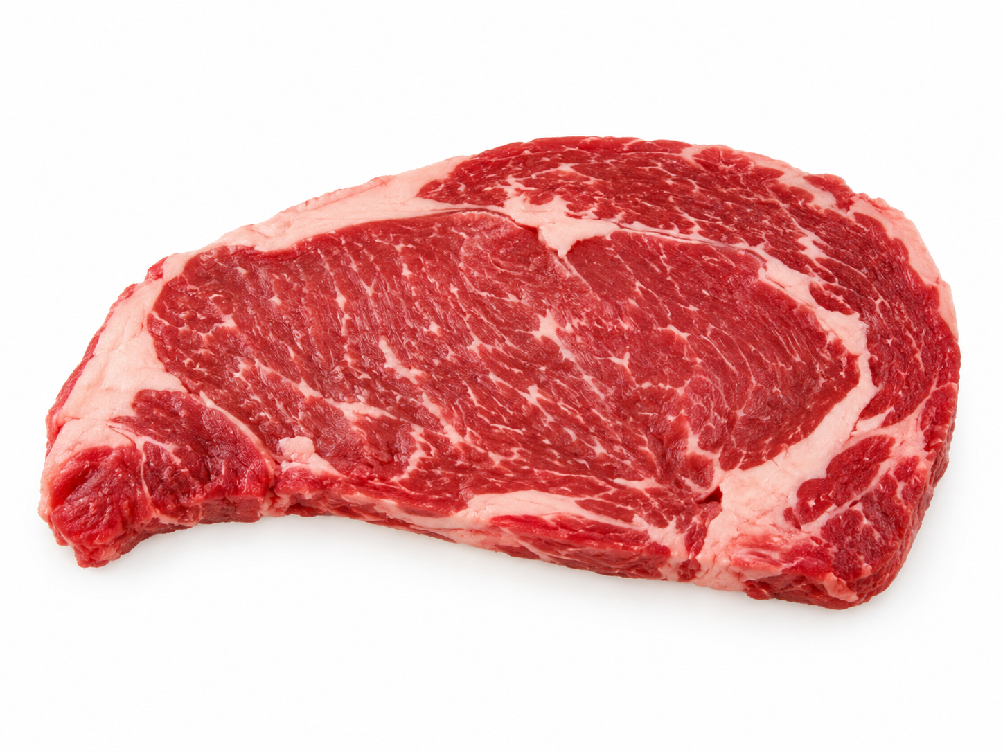 Uncooked Rib Eye steak on a white background